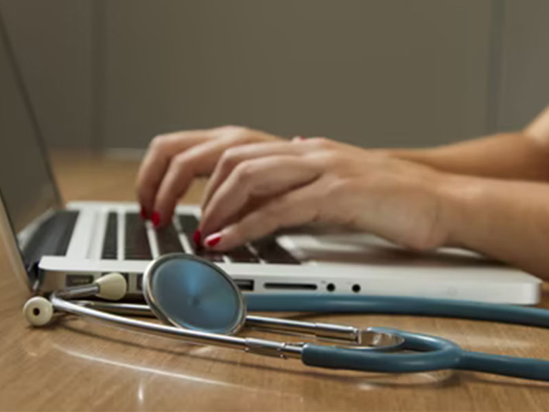 Person-using-a-Computer-with-a-Stethoscope